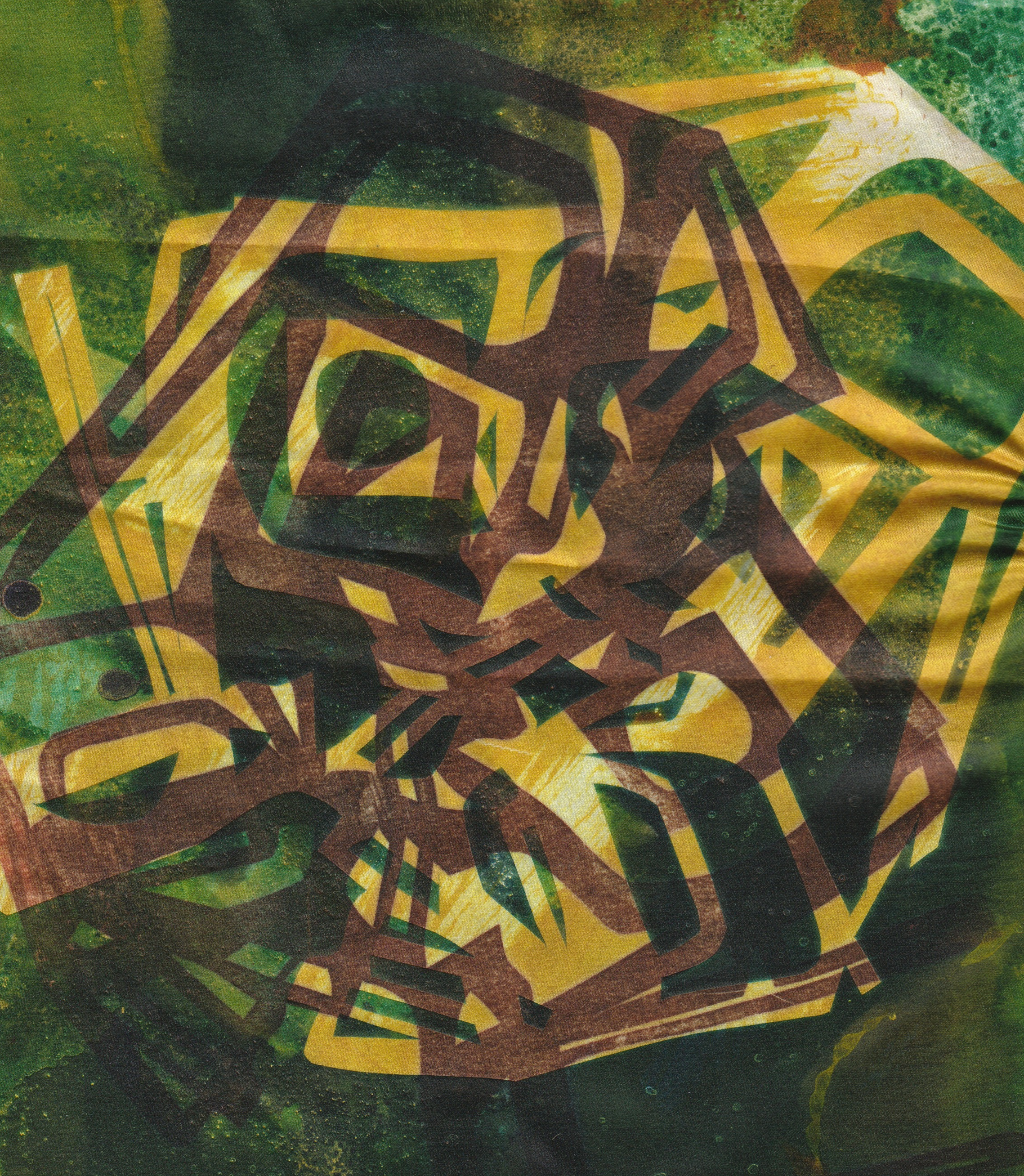 An abstract heat press print on fabric. On the green background is are two yellow and brown silouhettes of many chairs stacked on top of each other.